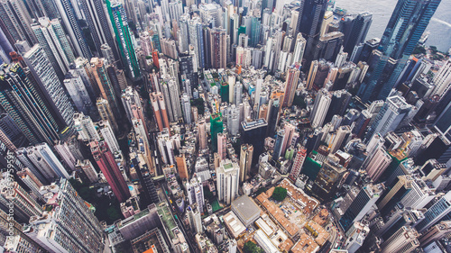Aerial photo from flying drone of an amazing landscape on a China city with modern skyscrapers and enterprises. Top view on a developed Hong Kong town with office buildings and advanced infrastructure