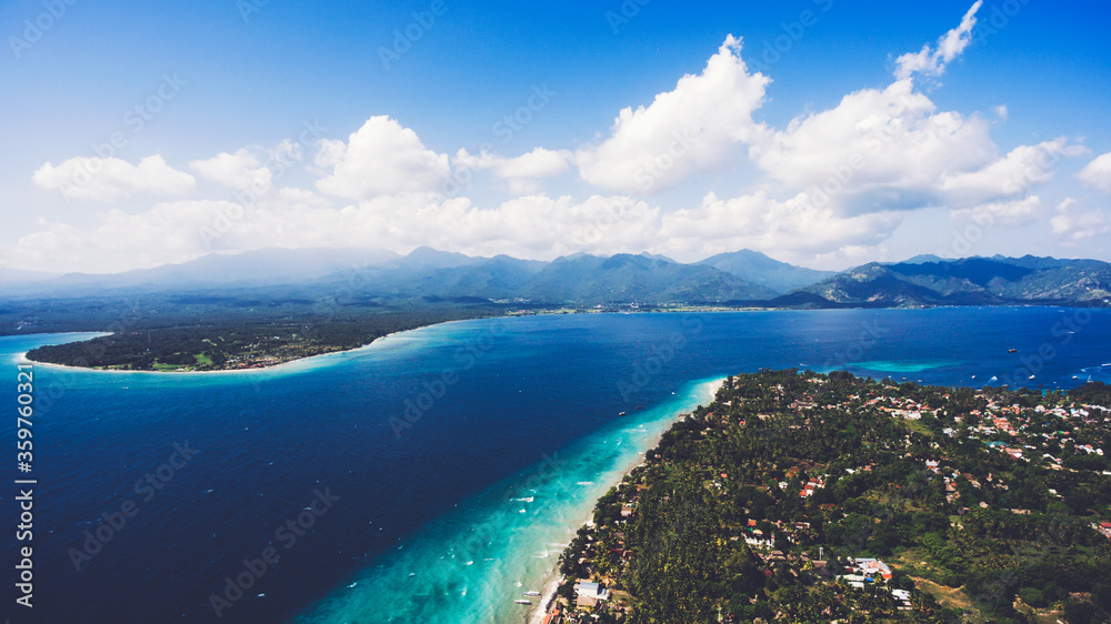 Aerial drone photo of archipelago of three small islands with name Gili, popular destination for tourists. Islands with beautiful coral formations for perfect snorkeling and diving leisure activity