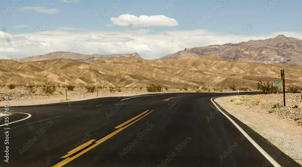 Crossroad on a desert with a scenic mountain landscape in Nevada, USA