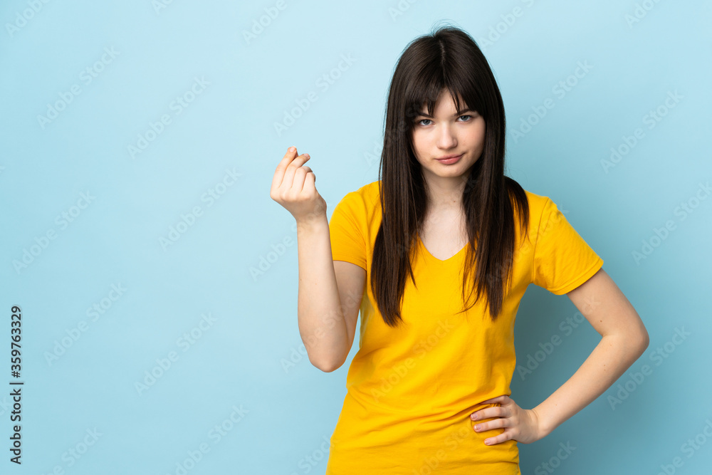 Teenager Ukrainian girl isolated on blue background making Italian gesture Teenager Ukrainian girl isolated on blue background making Italian gesture