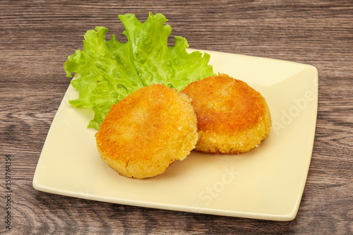 Vegan cuisine - Potato cutlet in the plate