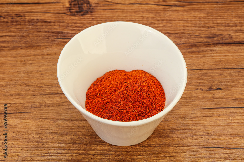 Dry paprika powder in the bowl Dry paprika powder in the bowl