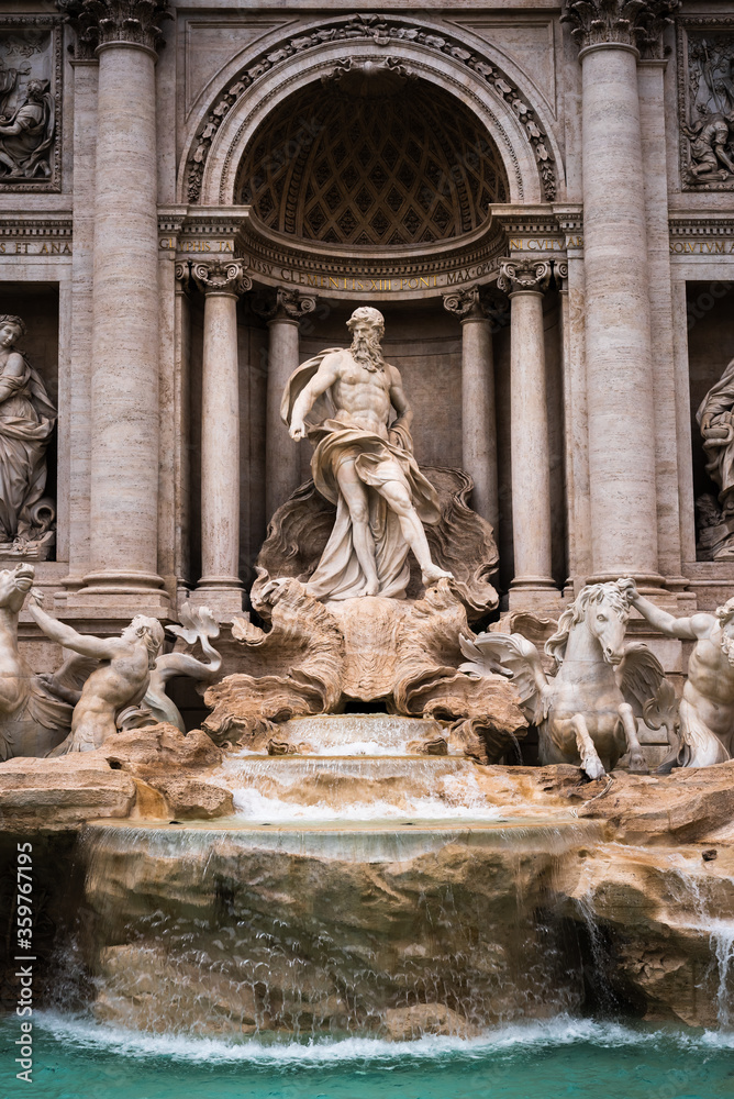 Iconic statue of Neptune in the famous Trevi Fountain in Rome