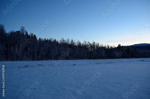 cold frozen field, beautiful sky and mountains in the arctic circle © Arcticphotoworks