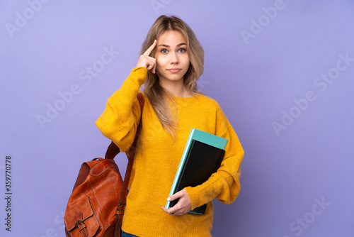 Teenager Russian student girl isolated on purple background thinking an idea
