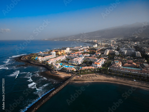 Aerial view of peninsula coastline. Big hotel resort in Playa de las Americas, Tenerife, Canary Islands, Spain.  © Mateusz Łopuszyński