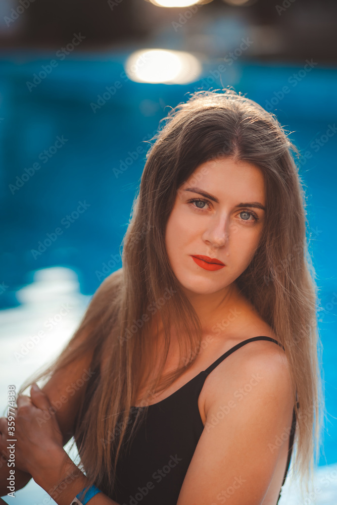 sexy young model at the sea by the pool