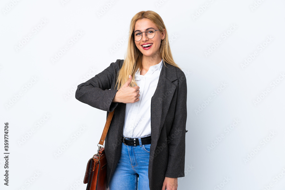 Business Uruguayan woman over isolated white background giving a thumbs up gesture Business Uruguayan woman over isolated white background giving a thumbs up gesture