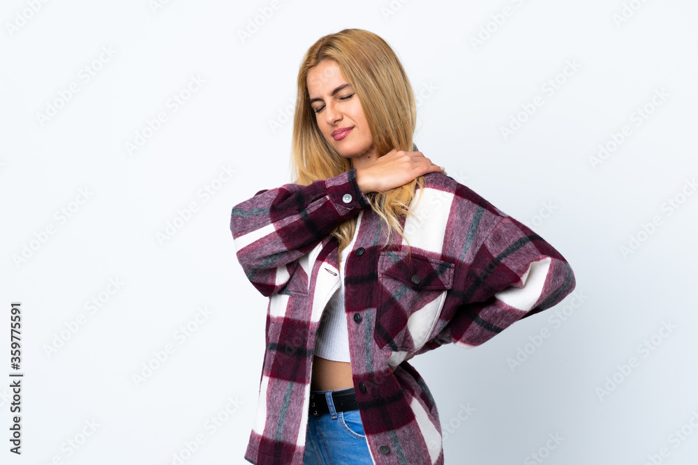 Young Uruguayan blonde woman over isolated white background suffering from pain in shoulder for having made an effort