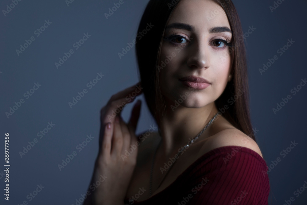 Art studio of a dramatic portrait of a young beautiful girl, with artistic retouching. Close-up, girl's face, with an expressive look. On a dark background. Beauty portrait Art studio of a dramatic portrait of a young beautiful girl, with artistic retouching. Close-up, girl's face, with an expressive look. On a dark background. Beauty portrait