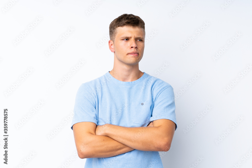 Young handsome man over isolated white background with confuse face expression Young handsome man over isolated white background with confuse face expression