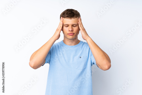 Young handsome man over isolated white background with headache