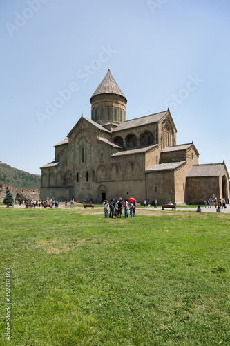 MTSKHETA, GEORGIA, JUNE 15: Tourists visits the ancient Svetitskhoveli Cathedral at Mtskheta town, Georgia on June 15, 2018 photo