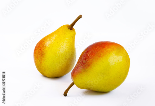 pear fruit, yellow fruits with red sides on a light background
