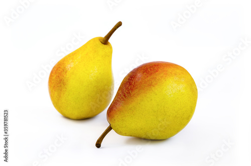 pear fruit, yellow fruits with red sides on a light background