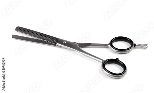 Hairdressing filer scissors isolated on a white background. Hair cutting scissors. Thinning shears. Professional shears.