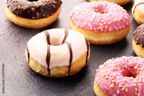 donuts in different glazes frosted with sprinkles