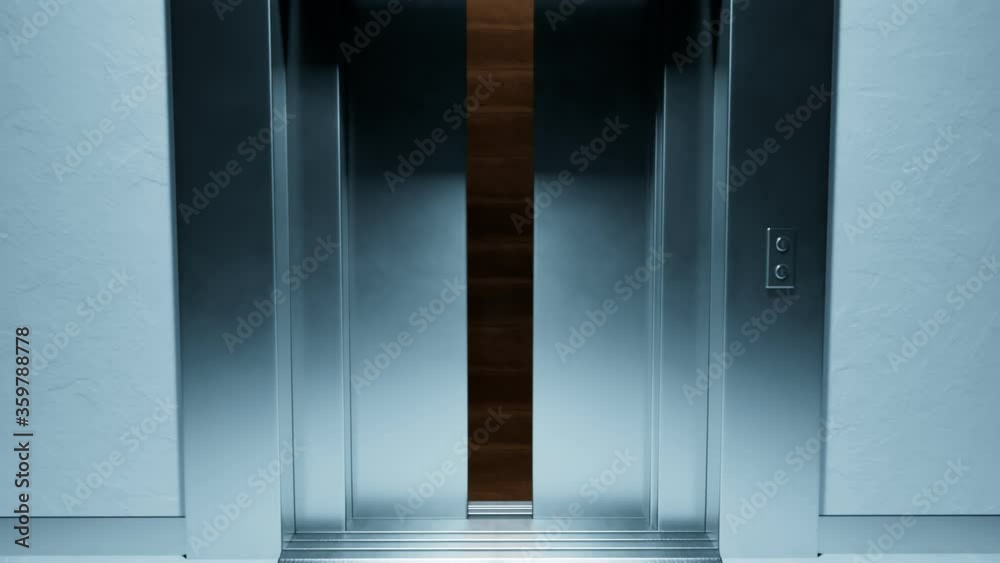 Elegant brushed steel elevator door opens revealing a deep, empty shaft. 4KHD