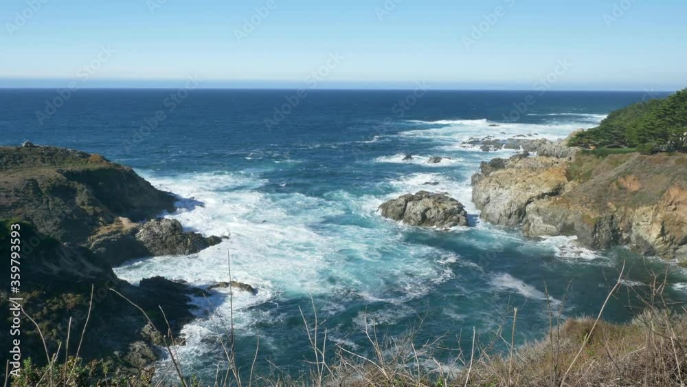Majestic Big Sur coastline waves crashing on the cliff rocks at California's Highway 1 scenic drive Majestic Big Sur coastline waves crashing on the cliff rocks at California's Highway 1 scenic drive