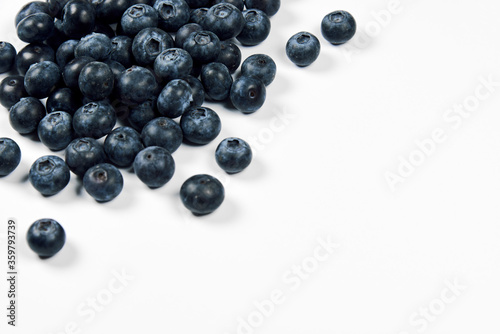 nature and healthy food concept - Top view of fresh blueberries isolated on white background. Copy space