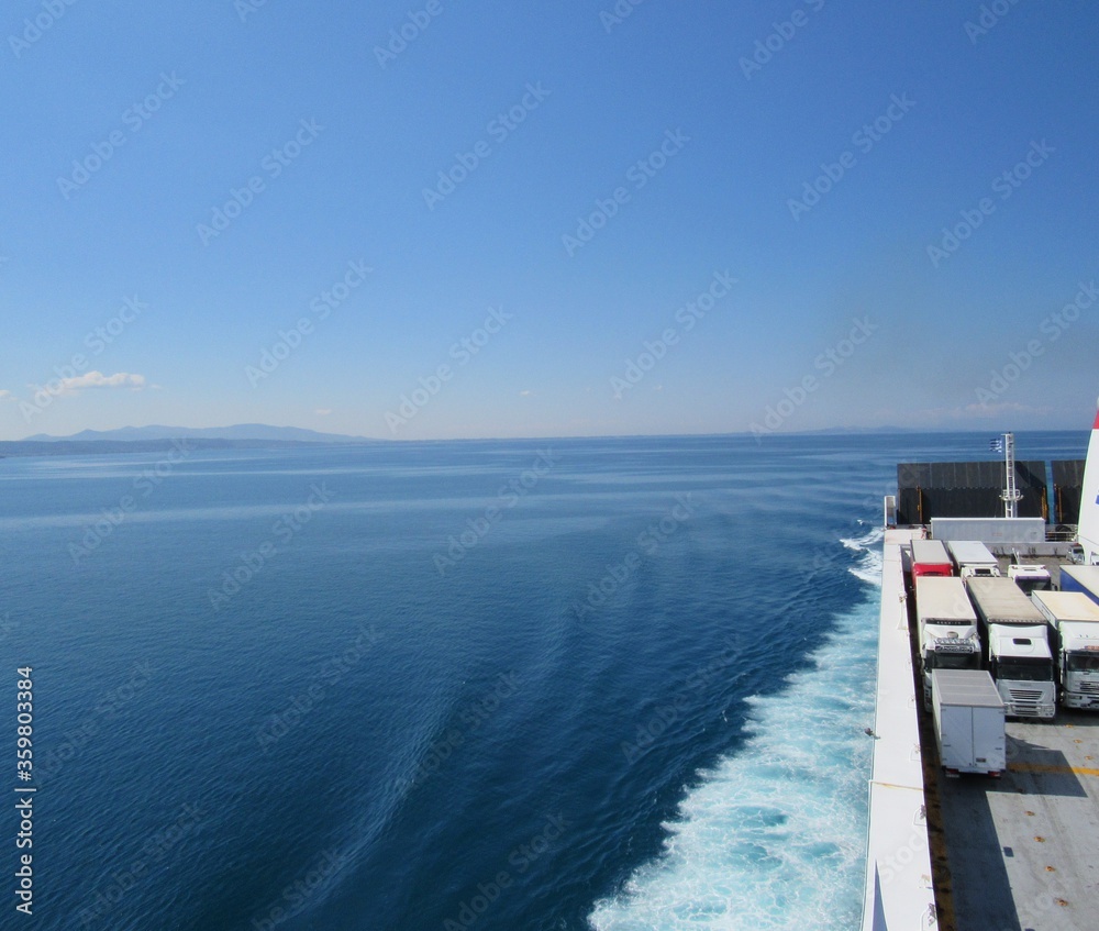 View of blue sky and ocean seen from a cruise ship between ports of Italy and Greece