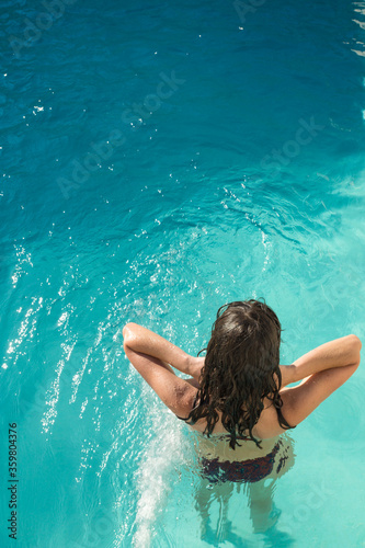 Woman bathing in the pool