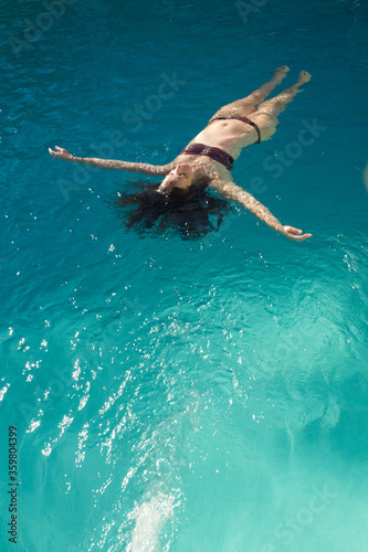 Woman bathing in the pool © Alvaro