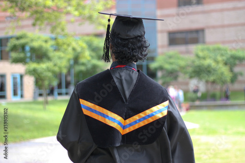 Student in graduation gown in graduation ceremony