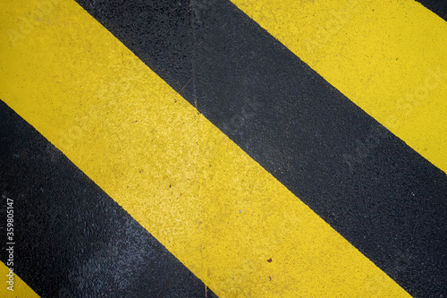 Yellow and black non slip surface area on boat to keep passengers from slipping when wet © Em Neems Photography