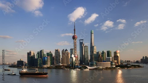 TL/ Asia, China, Shanghai, Time lapse of the Shanghai  skyline and Pudong river,  busy with cargo ships transporting goods