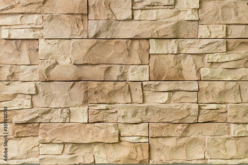 Obraz premium New materials in construction. The artificial stone imitating a brick wall. Seamless texture.
