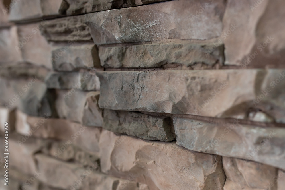 Fototapeta premium New materials in construction. The artificial stone imitating a brick wall. Seamless texture.