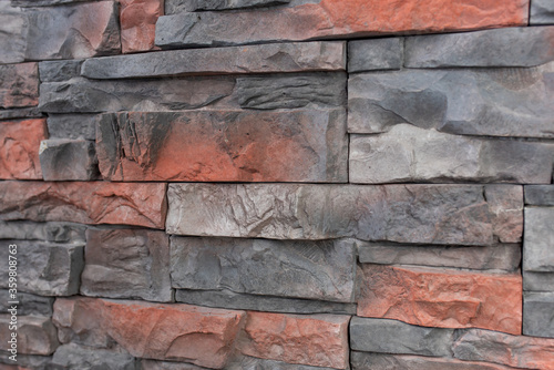 New materials in construction. The artificial stone imitating a brick wall. Seamless texture.