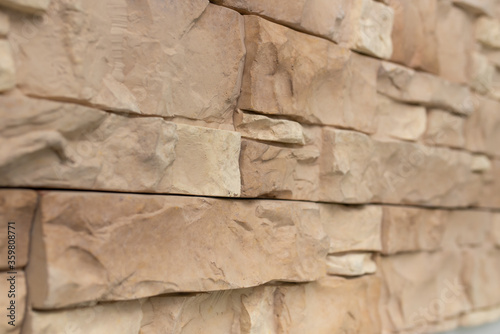 New materials in construction. The artificial stone imitating a brick wall. Seamless texture.