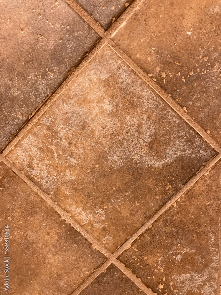 Brown rustic tan single wall tile forming a diamond abstract pattern Brown rustic tan single wall tile forming a diamond abstract pattern