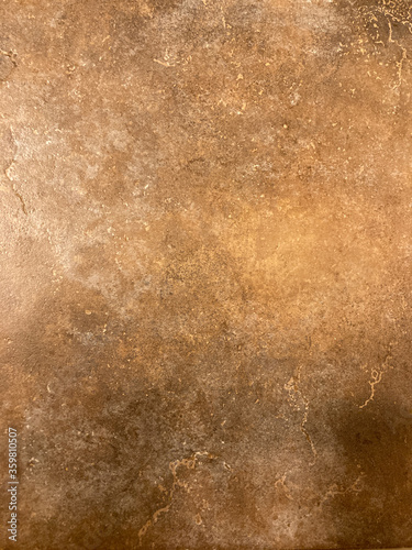 Background brown tan textured tile with blur and graduated patterns of irregular color