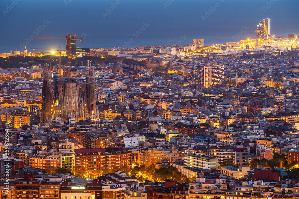 Aerial view of Barcelona cityscape at dusk, Spain.