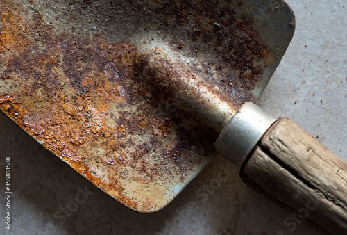 old rusty shovel up close showing rust patterns
