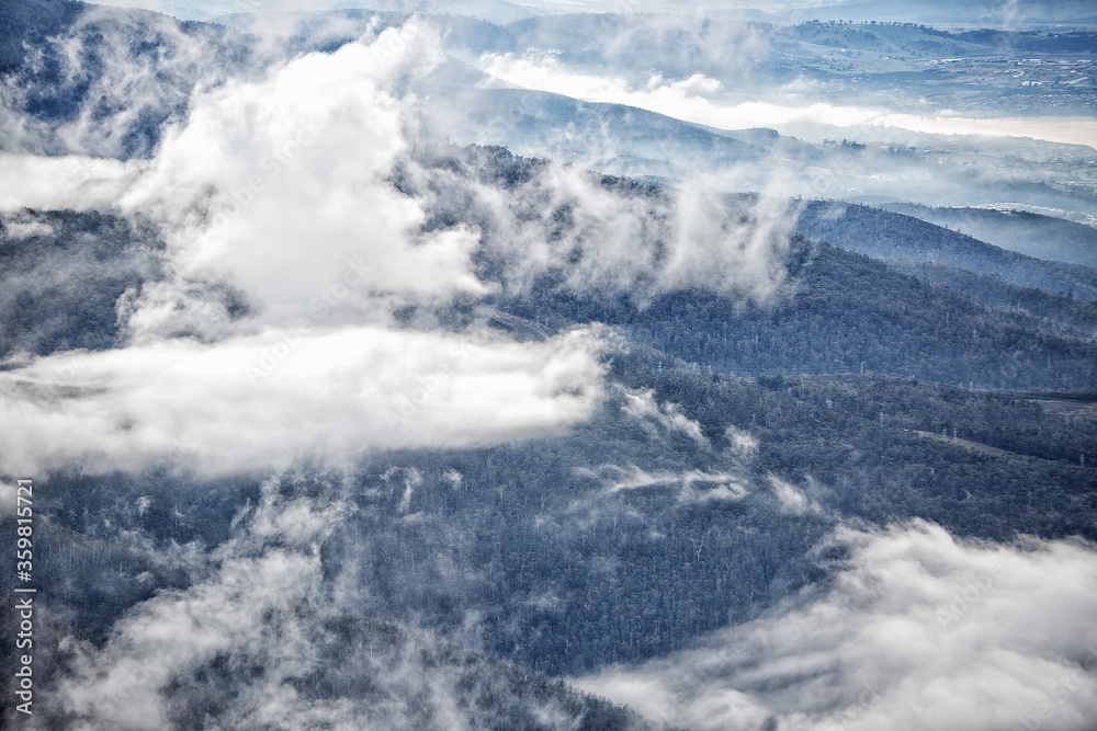 Low cloud and fog hugging the valleys and hilltops on a cold winter day in Hobart Tasmania