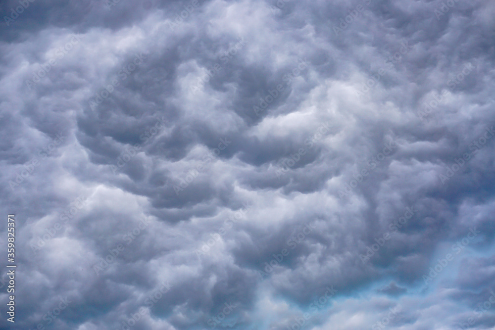 Fototapeta premium incredible swirling gray clouds, voluminous sky background, storm 