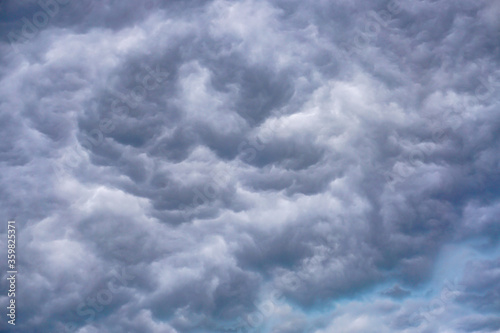 incredible swirling gray clouds, voluminous sky background, storm
