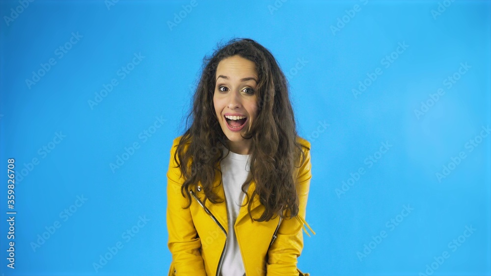 Portrait of pretty brunette long-haired woman being impressed feeling happy