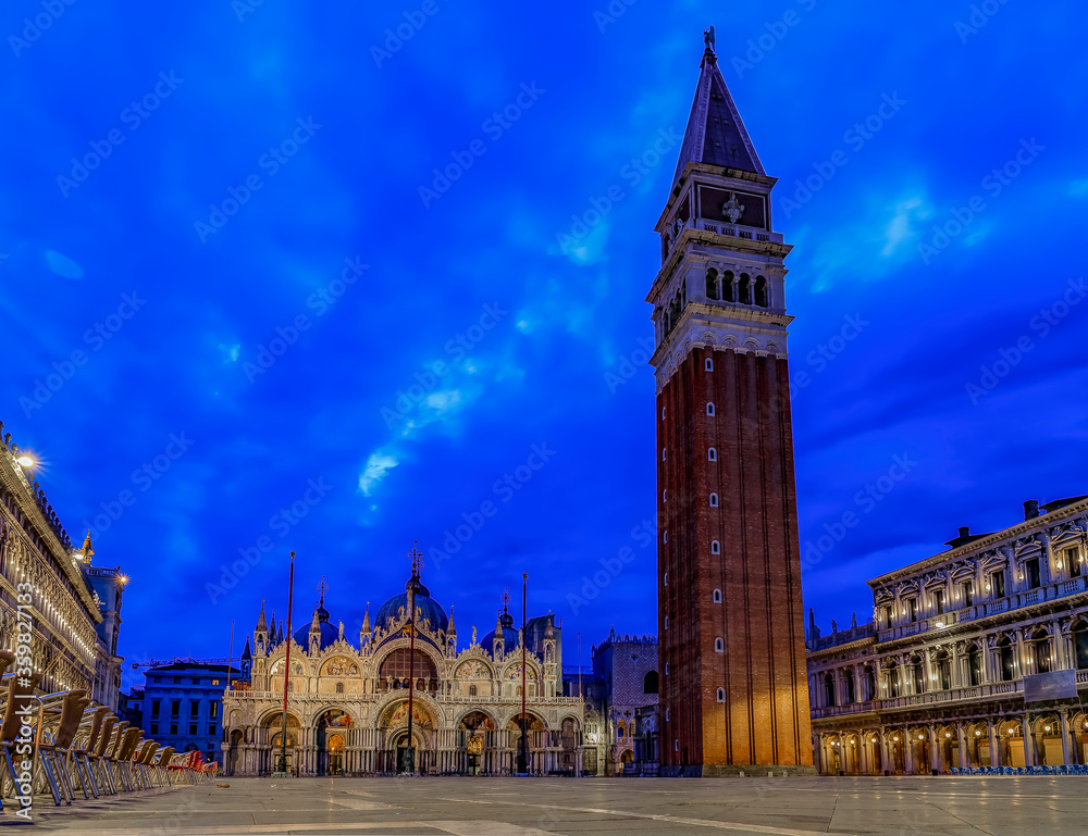 Saint Mark's square with the  Campanile and Saint Mark's Basilica at sunrise in Venice Italy
