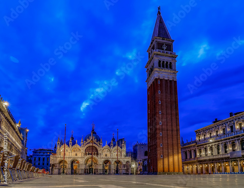 Saint Mark's square with the Campanile and Saint Mark's Basilica at sunrise in Venice Italy