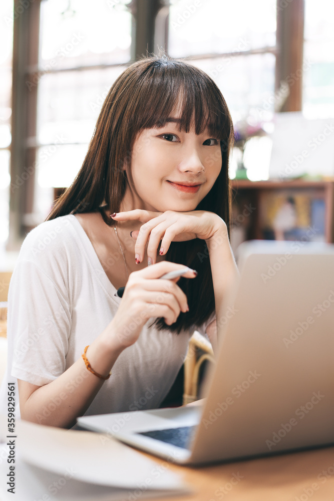 Young asian woman teenager online learning at home via internet computer Young asian woman teenager online learning at home via internet computer
