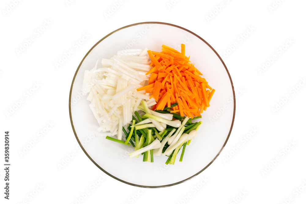 Cut fresh vegetables in julienne, carrots, scallions and daikon