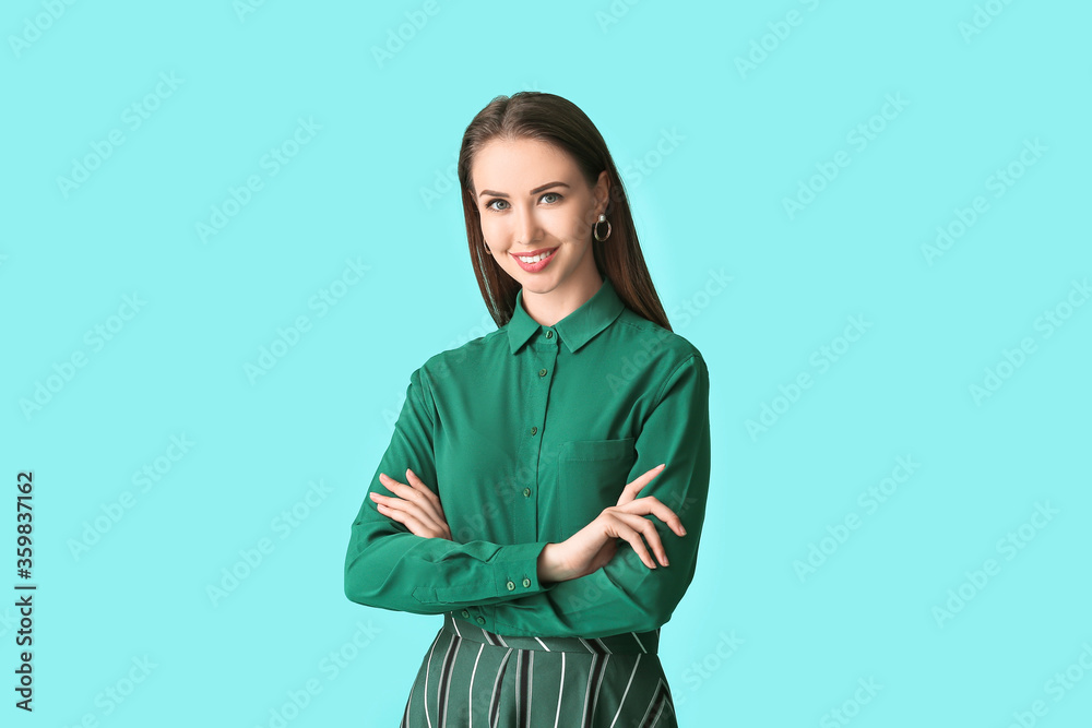 Beautiful young businesswoman in stylish shirt on color background Beautiful young businesswoman in stylish shirt on color background