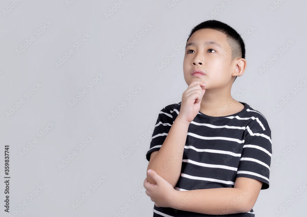 Asian boys studio portrait on gray background Asian boys studio portrait on gray background