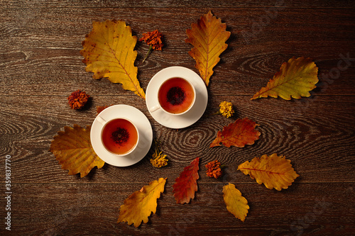 Cups of tea with autumn leaves. Top view © Алексей Сыркин