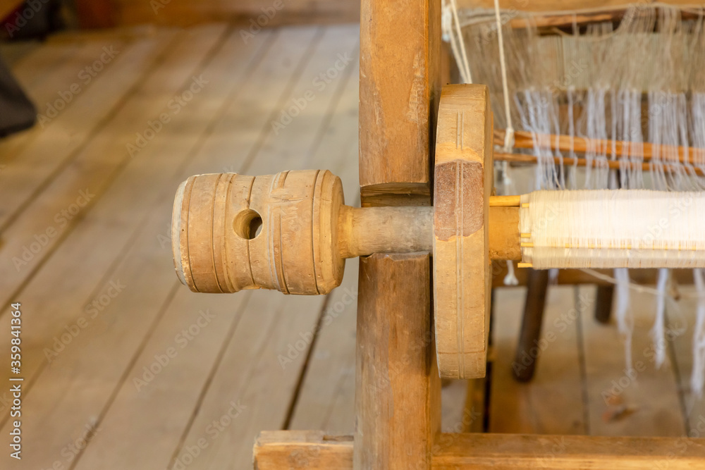 traditional loom with wooden shaft closeup rustic design